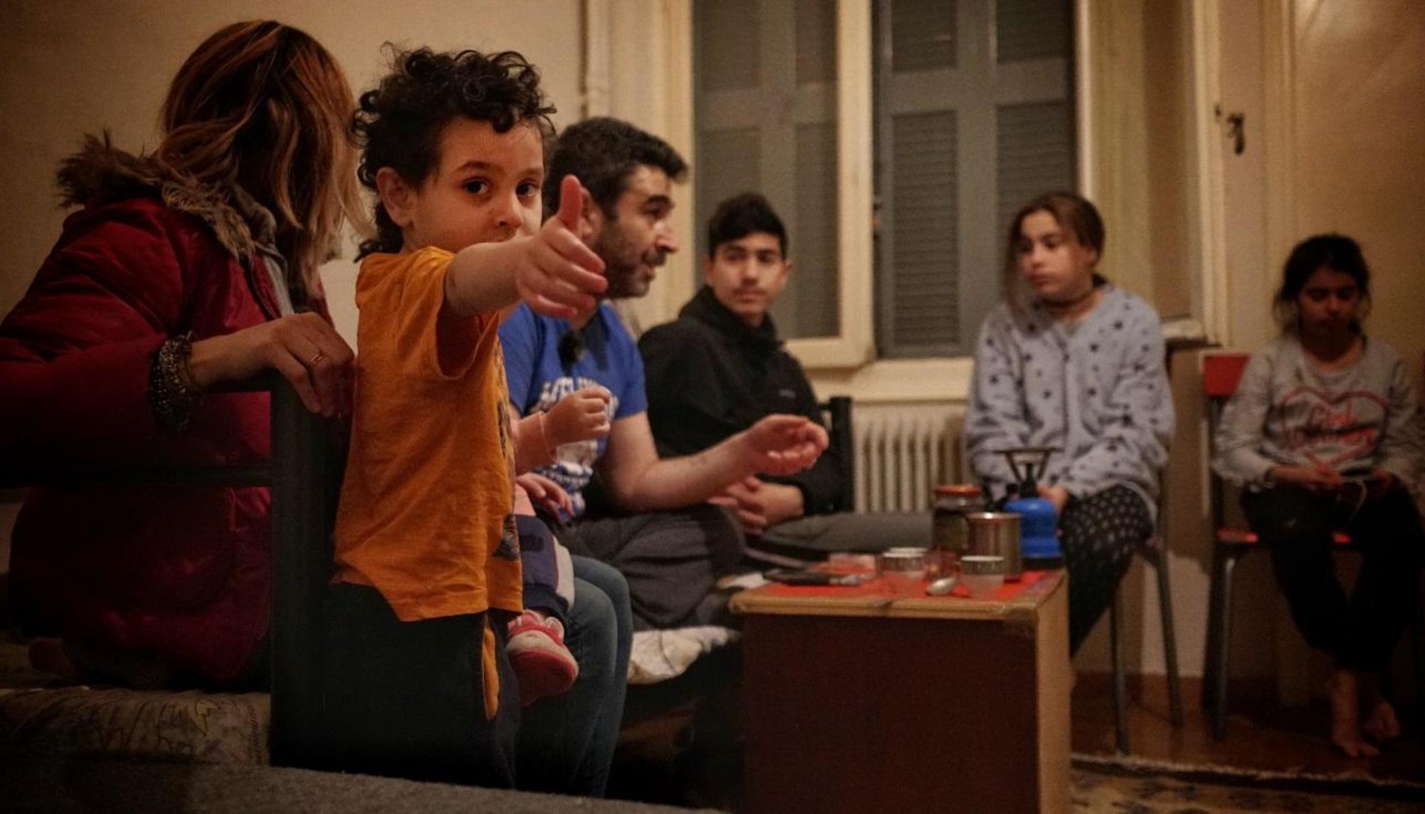 Familia refugiados en Grecia