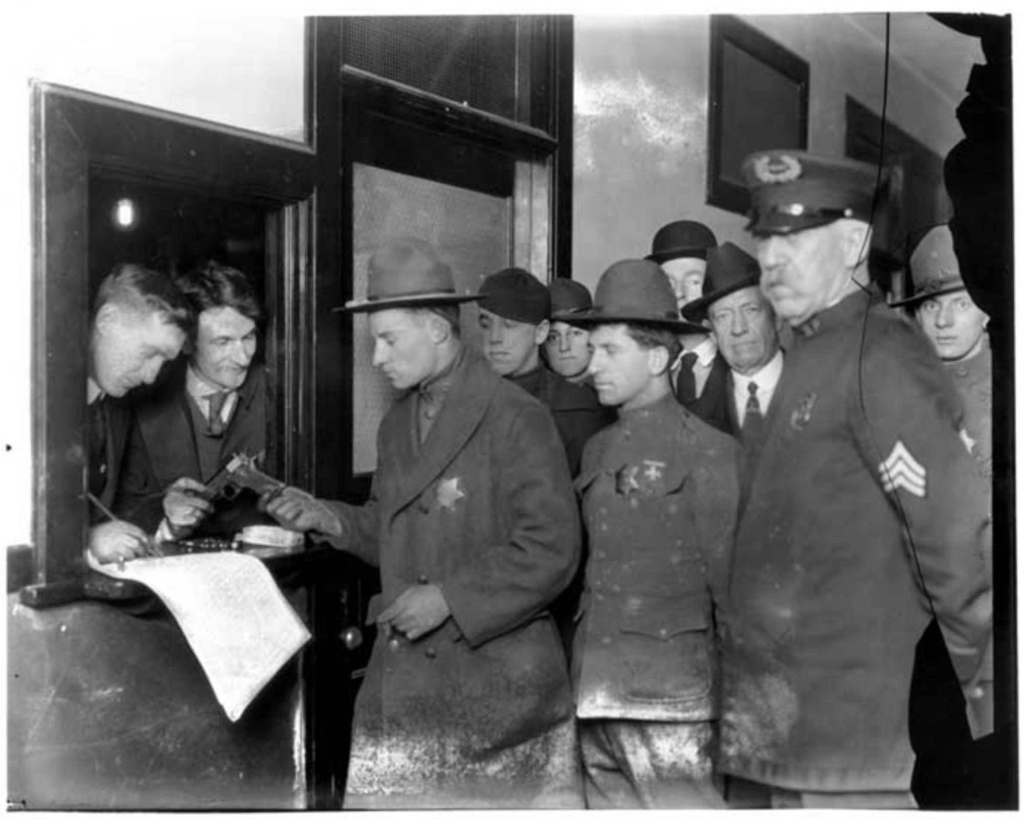 Seattle General Strike deputies receiving weapons, February 6, 1919. Webster & Stevens