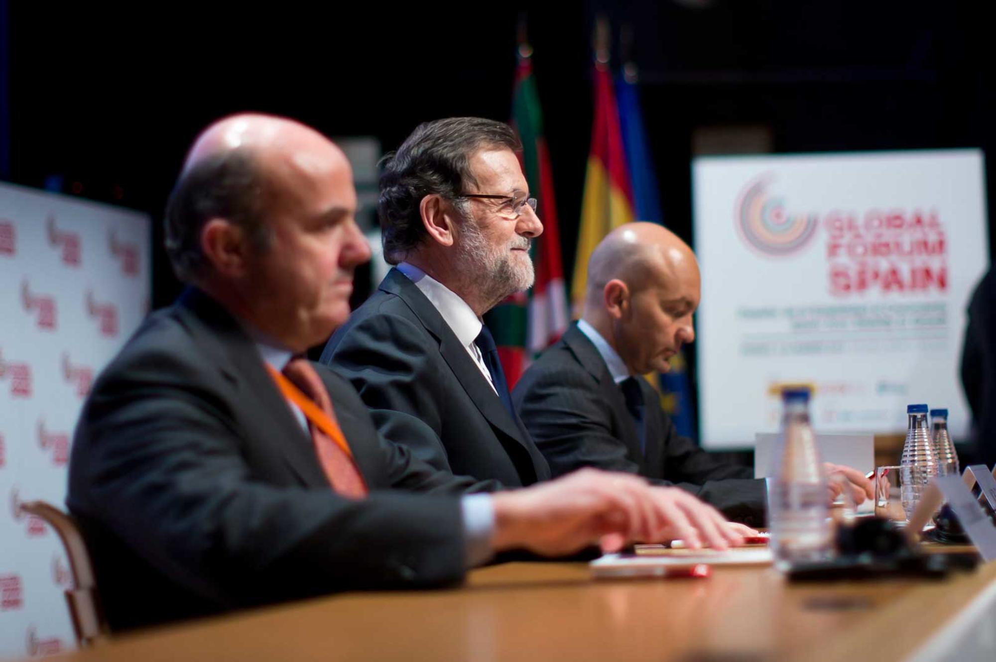 Guindos y Rajoy.