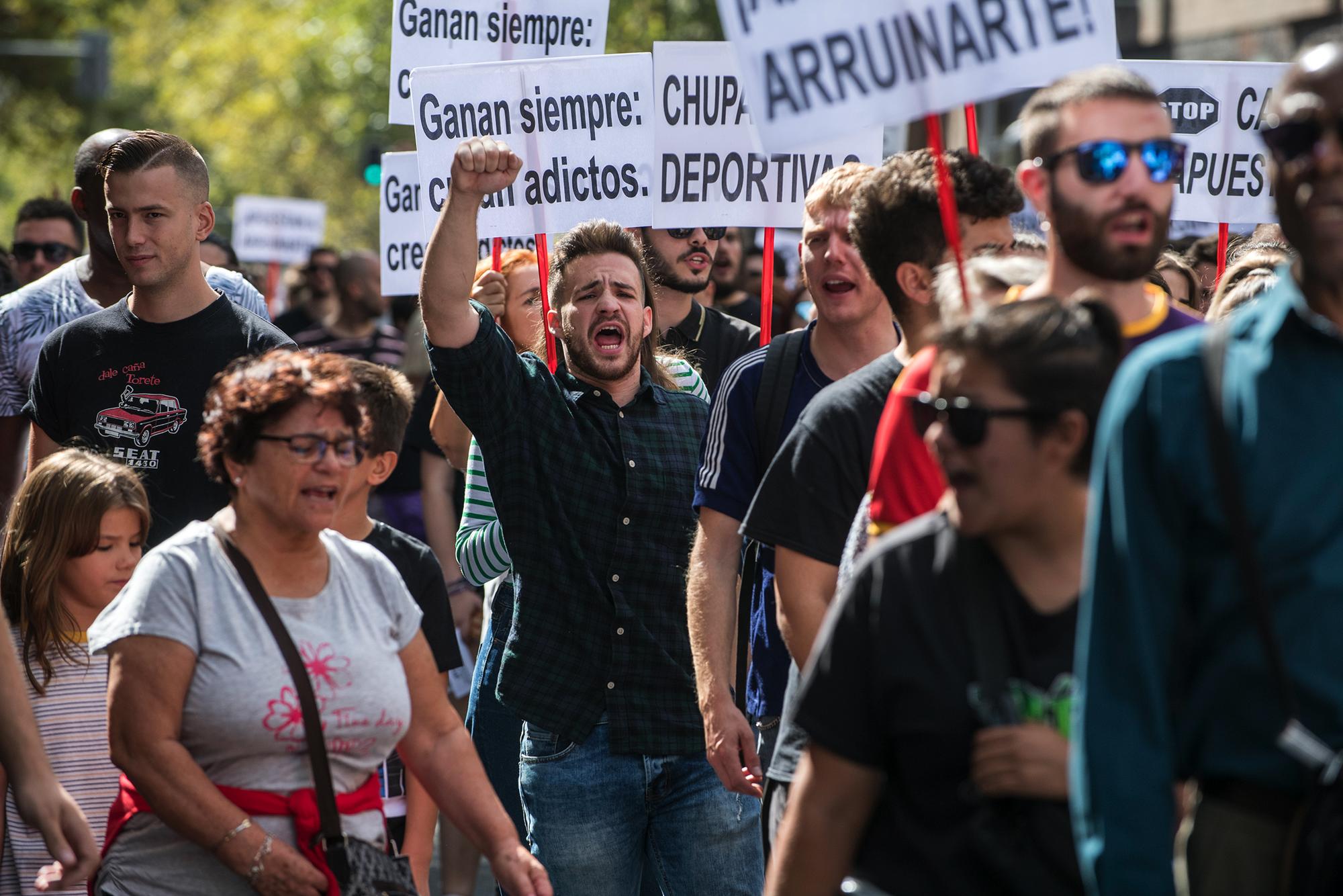 Manifestacion contra las casa de apuestas en el barrio de Tetuan, Madrid.